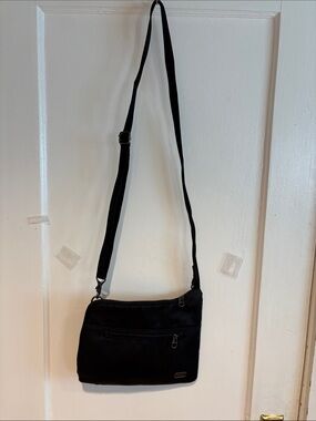 PacSafe lightweight, nylon cross bag. 11x9x”